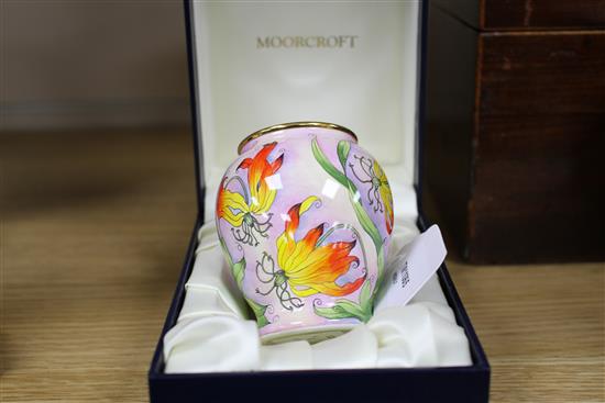A Moorcroft Enamels miniature vase decorated with stylised fire lilies, boxed, AR initials to base 8cm